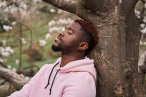 a person relaxes outdoors after learning where to detox