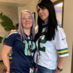 two-women-in-sports-shirts