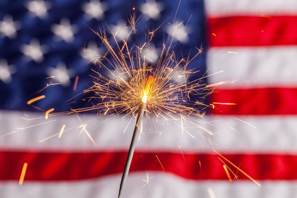 a sparkler in front of a flag a relapse prevention plan is important to enjoy a sober fourth of july