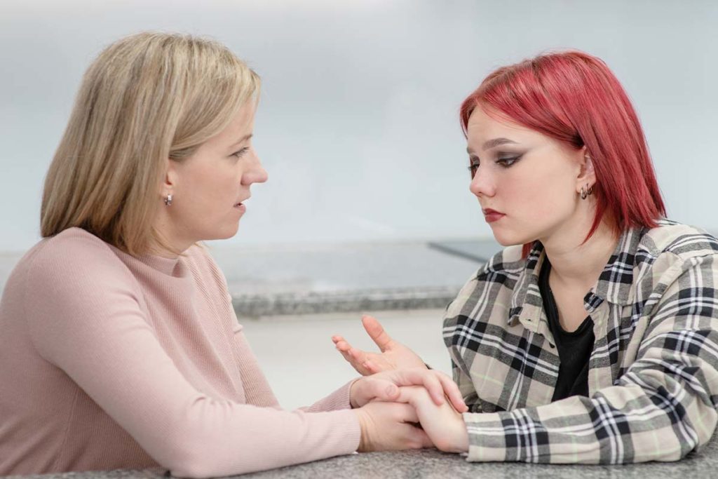 a parent talks to their child about Teens using drugs