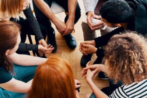 a group meets in a dxm cough medicine addiction treatment program