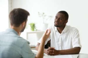 a person talks to a therapist in a buprenorphine addiction treatment program