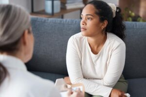 a person looks away after someone sitting across from them said they recognized signs you may need benzo rehab