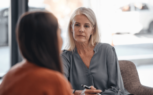 a therapist talks to a patient about the benefits of vivitrol treatment for addiction