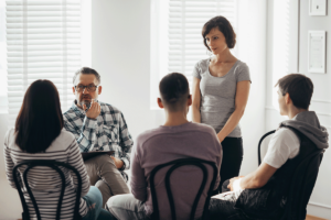 a group of relatives discuss "when is family therapy needed?"